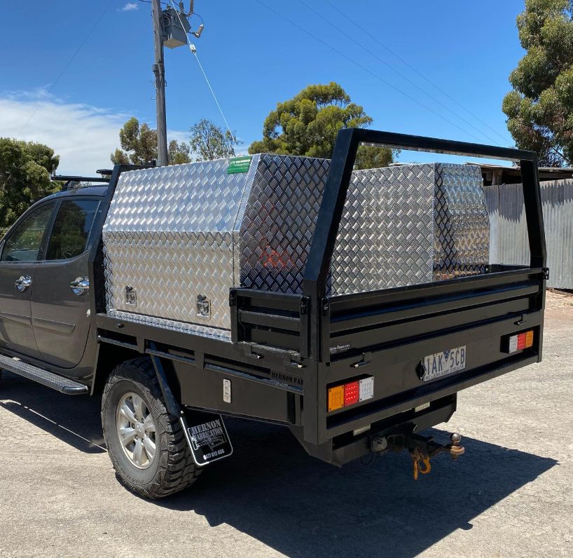 Custom black ute canopy with aluminium checkerplate toolboxes